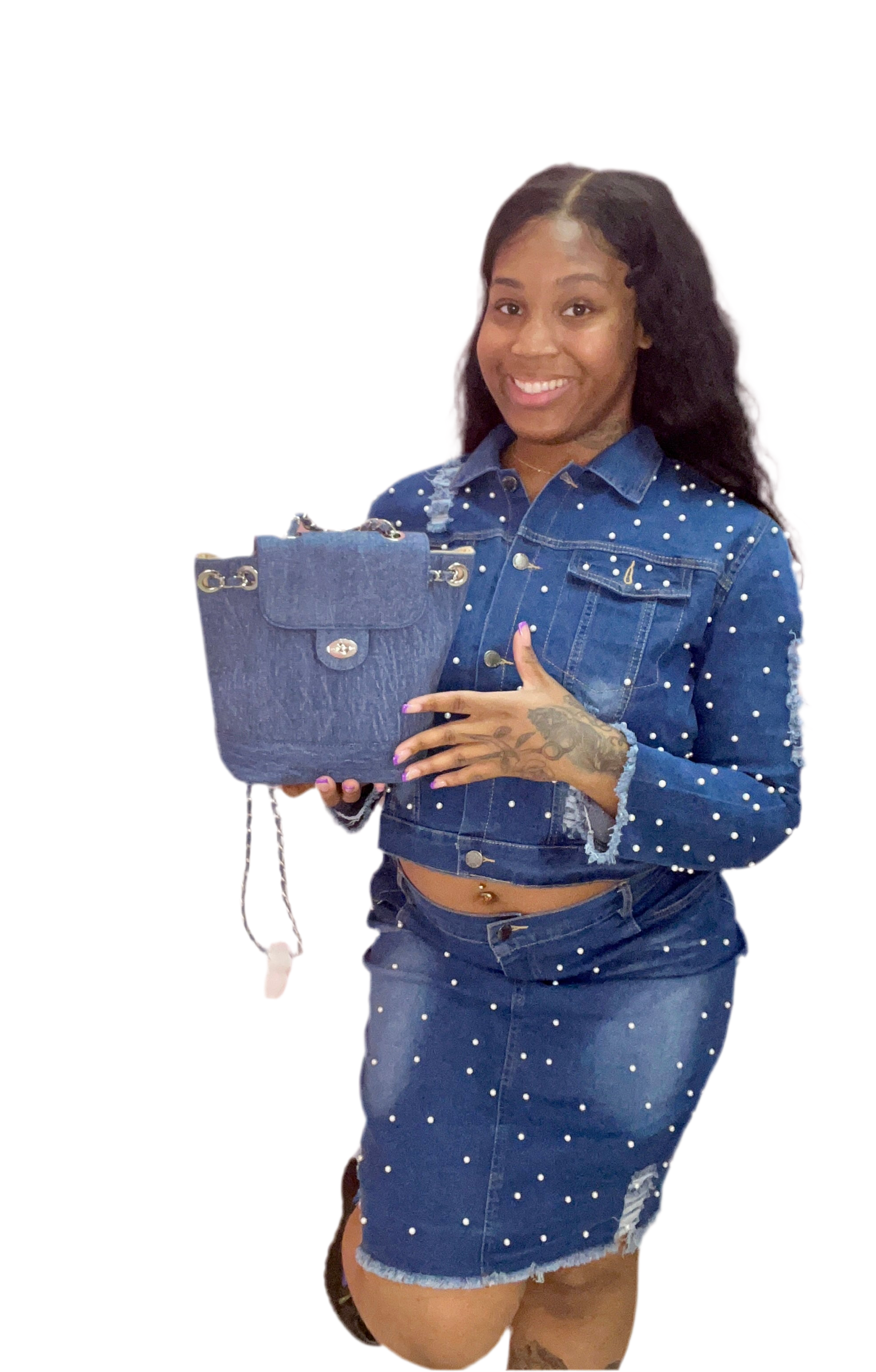 Woman holding a blue denim handbag against a white background